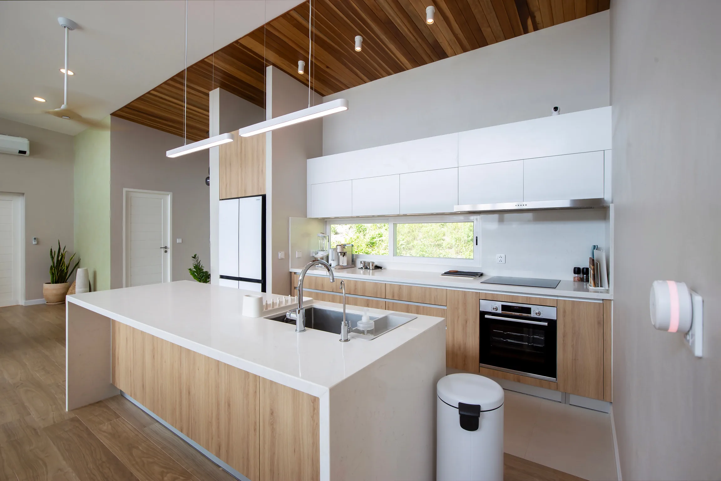 Custom island kitchen with Bosch oven and dishwasher