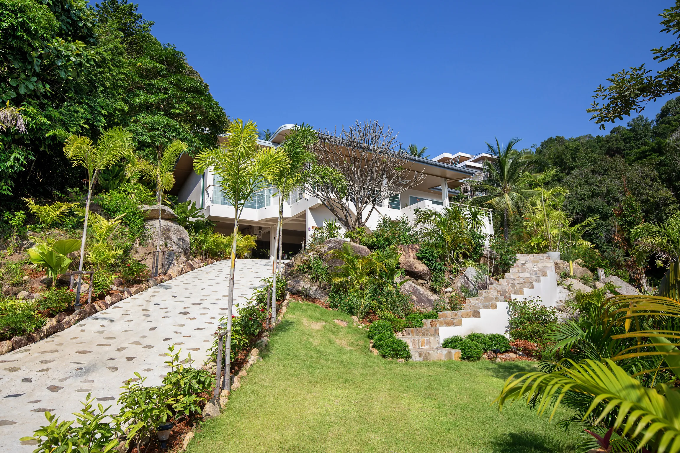 Private stone driveway and 1-rai landscaped garden